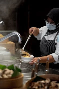 head chef preparing fresh pizza dough