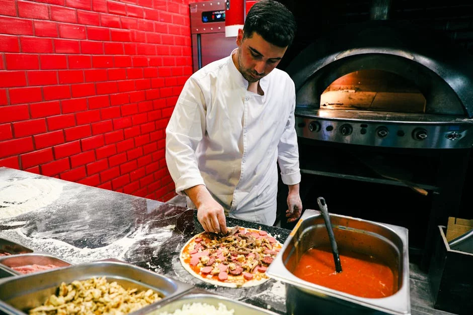 bustling pizza kitchen with chefs at work